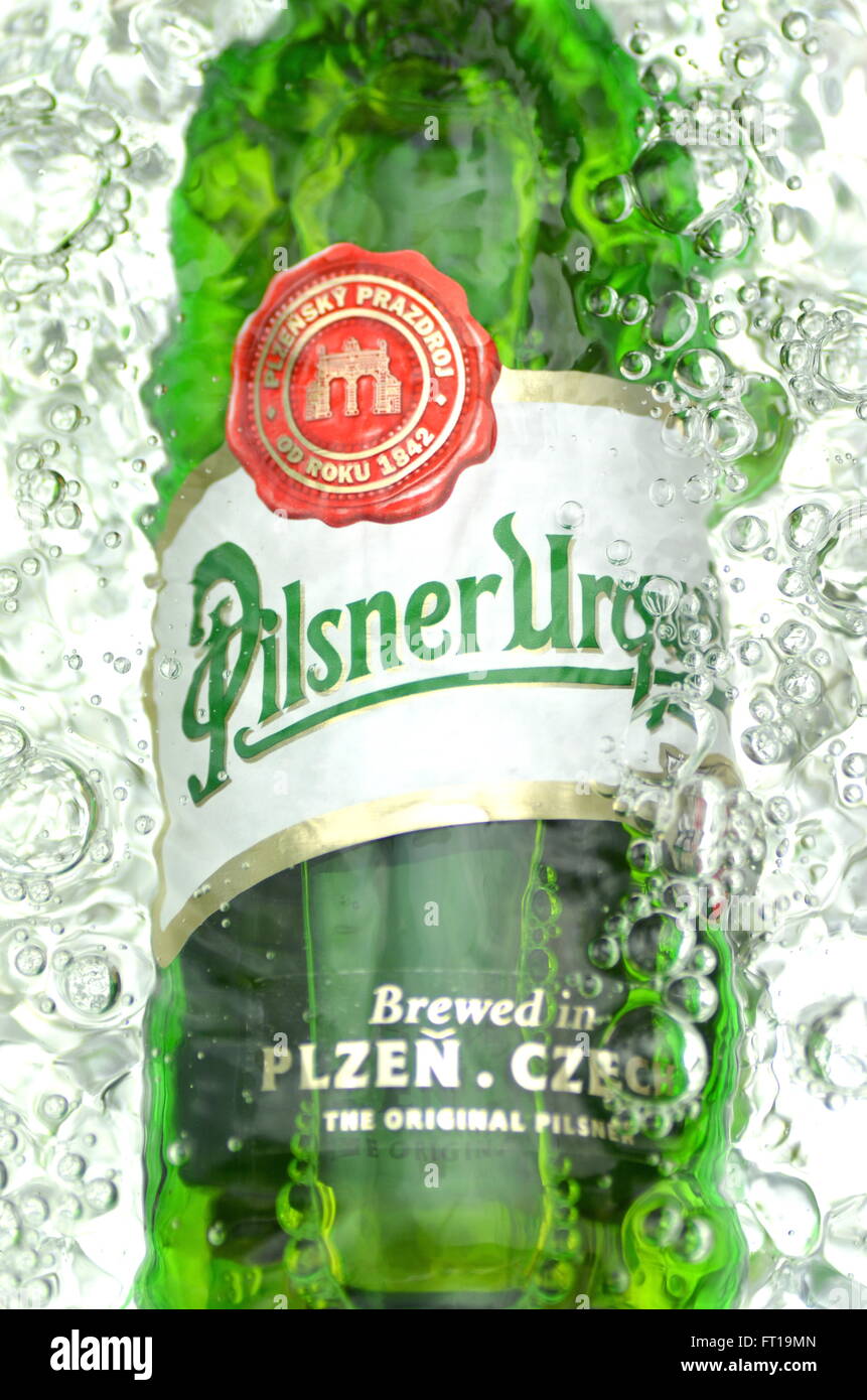 Pilsner Urquell pale lager beer in splashed water. It has been produced since 1842 in Pilsen, Czech Republic. Pilsner Urquell wa Stock Photo
