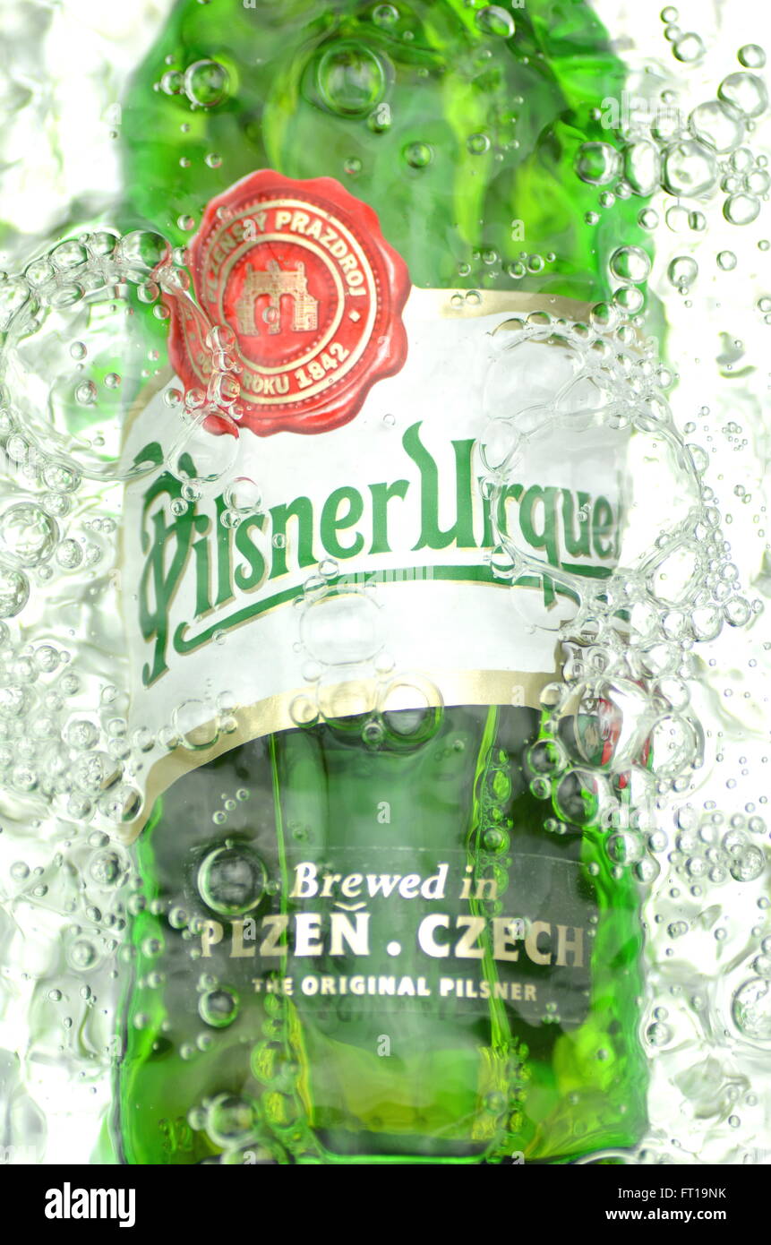 Pilsner Urquell pale lager beer in splashed water. It has been produced since 1842 in Pilsen, Czech Republic. Pilsner Urquell wa Stock Photo