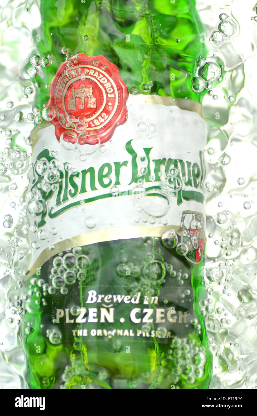 Pilsner Urquell pale lager beer in splashed water. It has been produced since 1842 in Pilsen, Czech Republic. Pilsner Urquell wa Stock Photo