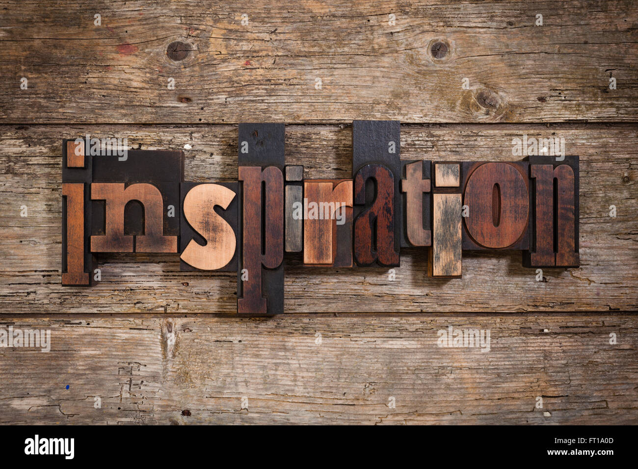 Inspiration, word written with vintage letterpress printing blocks on rustic wooden background Stock Photo