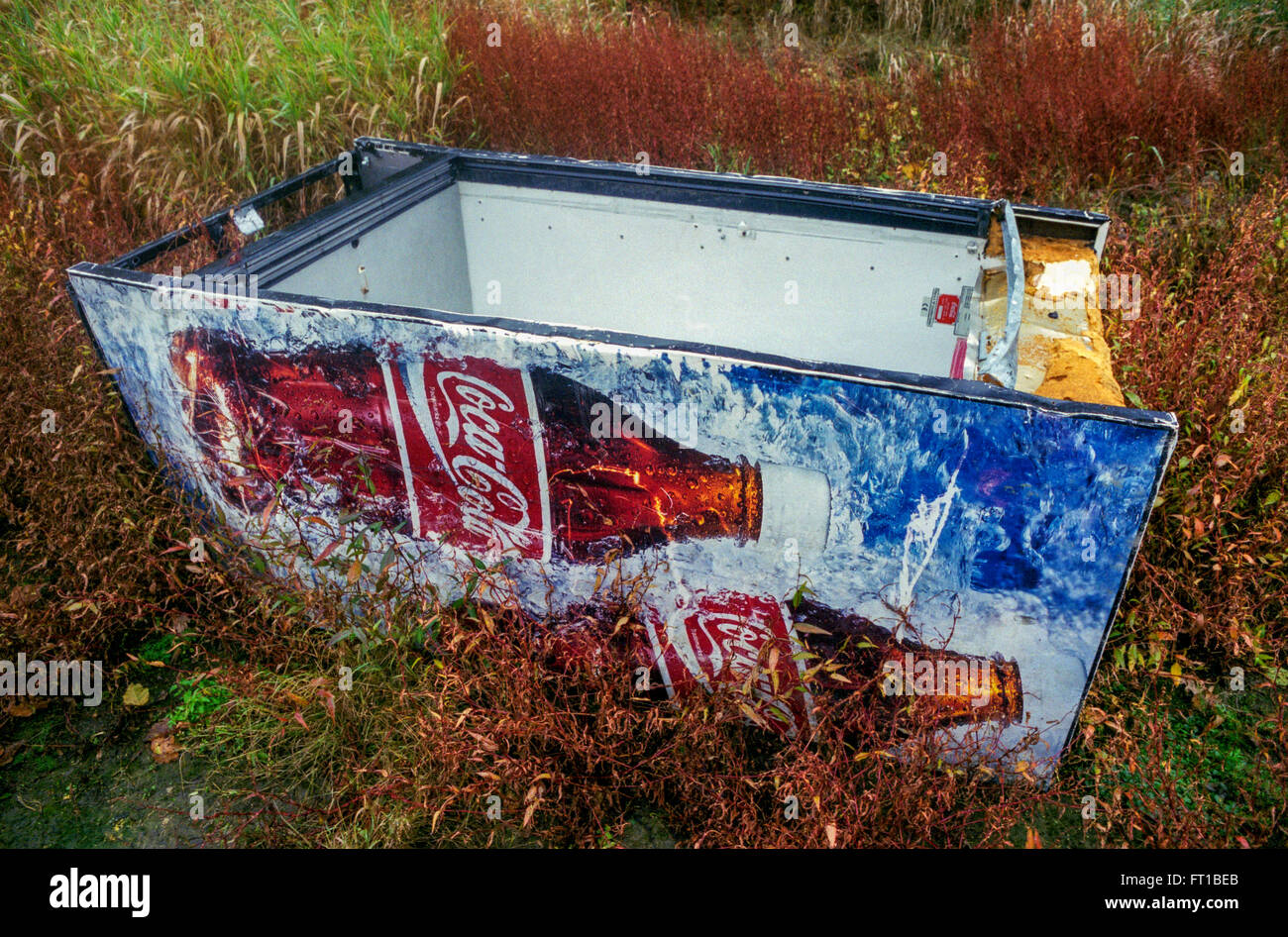Remnants of the former refrigerator with advertising for Coca-Cola, kicked in the country, Czech Republic Stock Photo