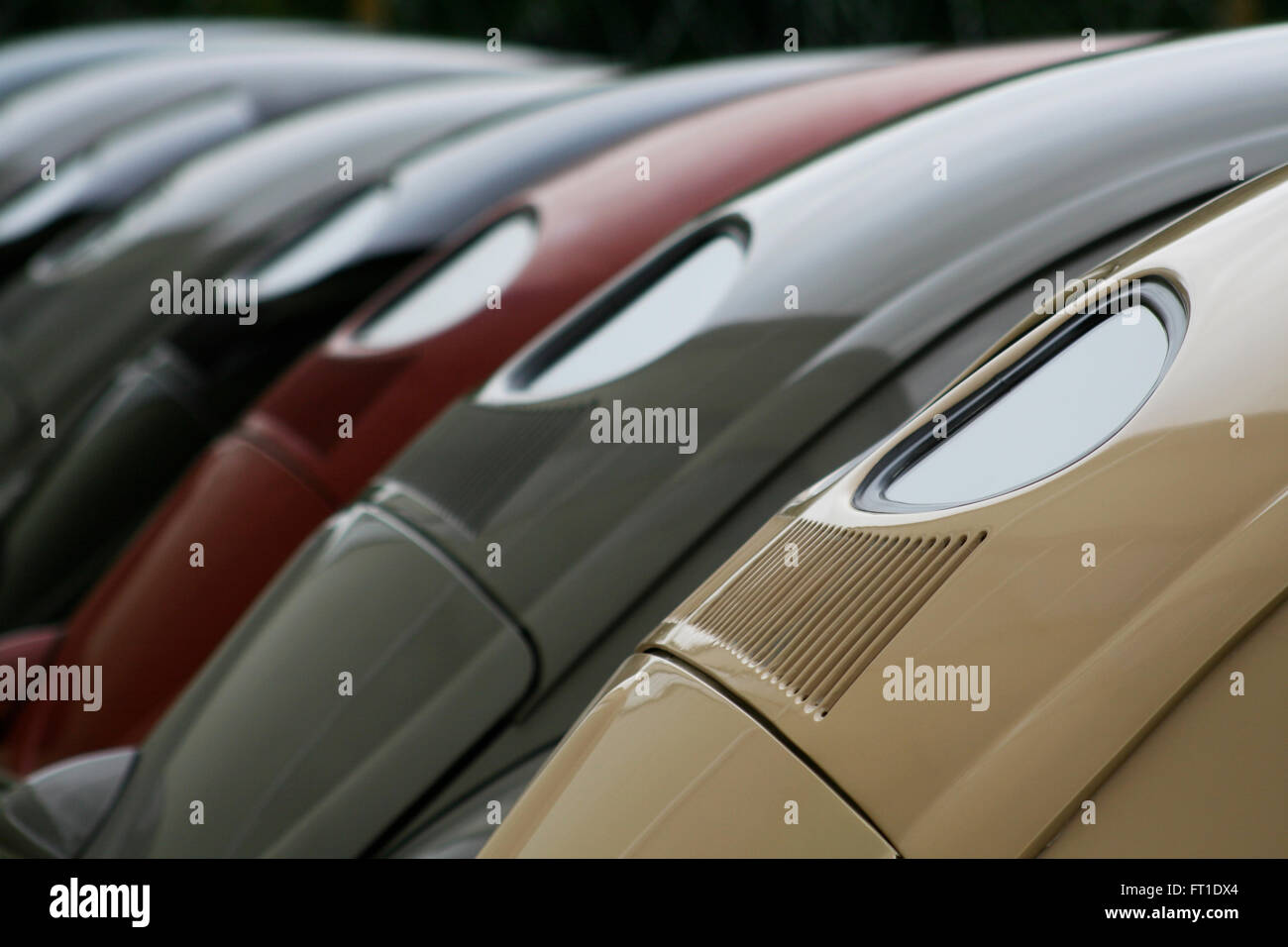 Line up of early 'split rear window' Volkswagen Beetles at a vintage VW rally. Stock Photo