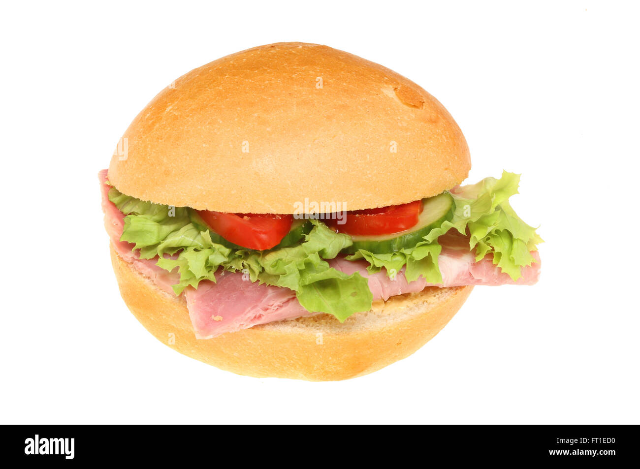 Ham and salad in a crusty bread roll isolated against white Stock Photo