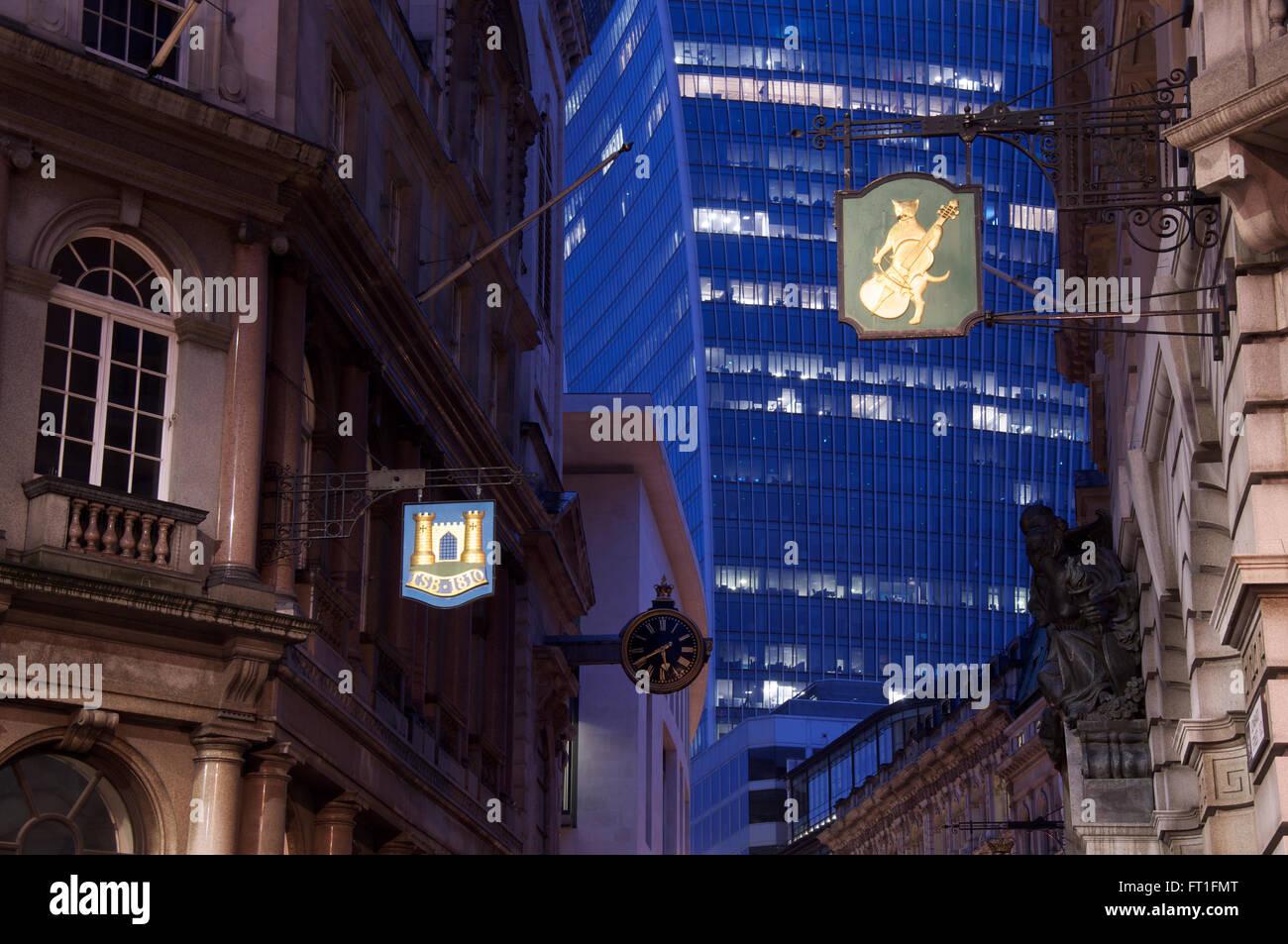Old buildings and traditional commercial signs alongside modern architecture in historic Lombard Street. The City of London, England, United Kingdom. Stock Photo