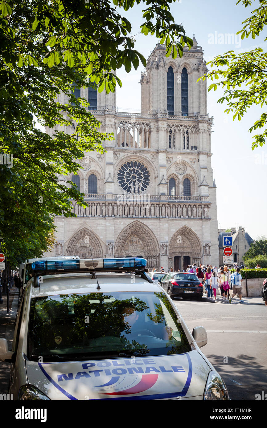 Police car in front of Notre Dame in Paris France Stock Photo
