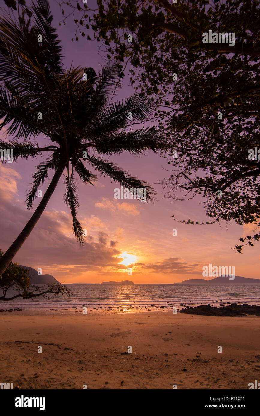 Tropical sunset on the beach in Thailand Stock Photo - Alamy
