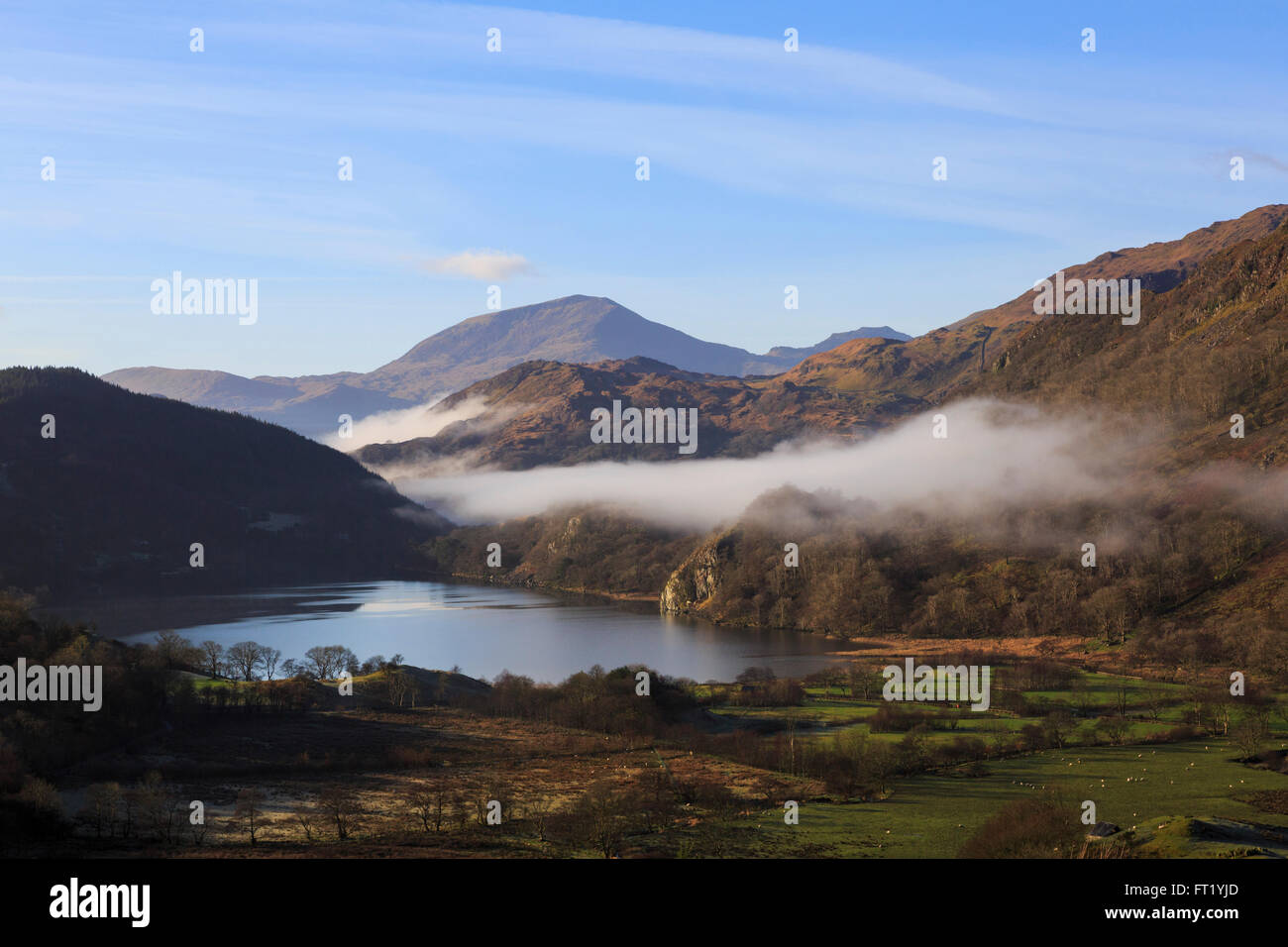 Scenic view along valley to Llyn Gwynant lake and Yr Aran with mist in mountains of Snowdonia National Park. Nantgwynant Wales Stock Photo