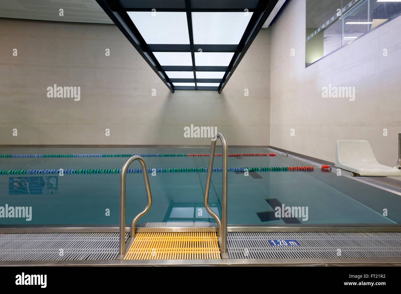Indoor swimming pool entry ladder Stock Photo