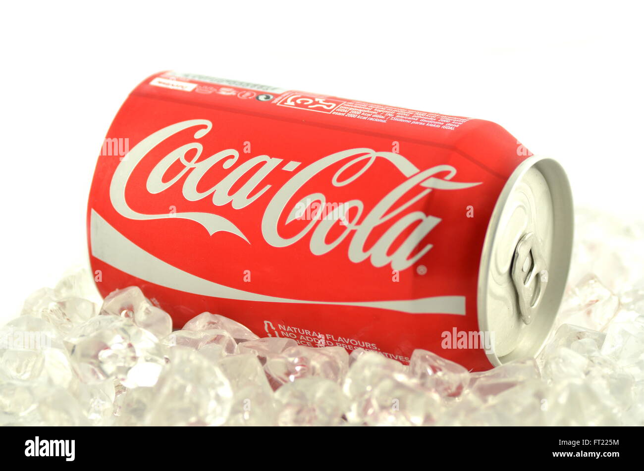 Coca-Cola drink in a can on ice isolated on white background Stock Photo