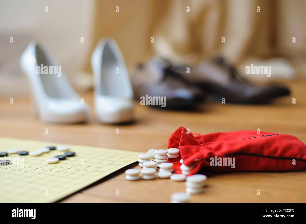 White And Black Stones To Play Go On The Floor Next To The Board Red Bag With Stones The 