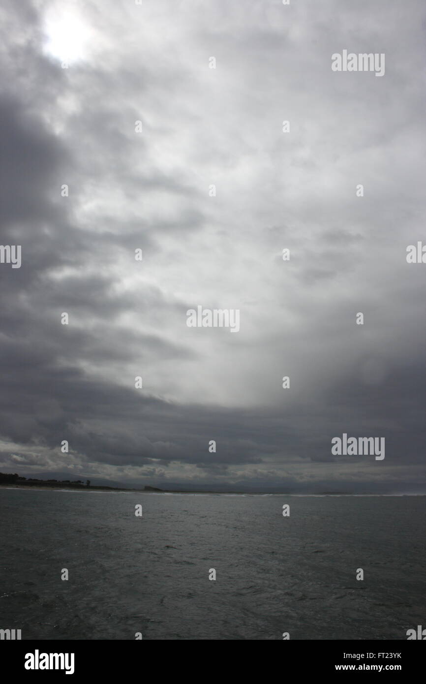 Ominous cloudy sky over the pacific ocean near Monterey Stock Photo