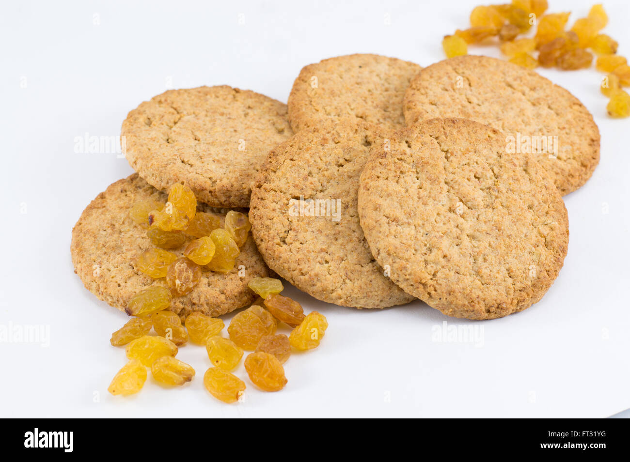 Integral cookies with yellow raisins on white Stock Photo