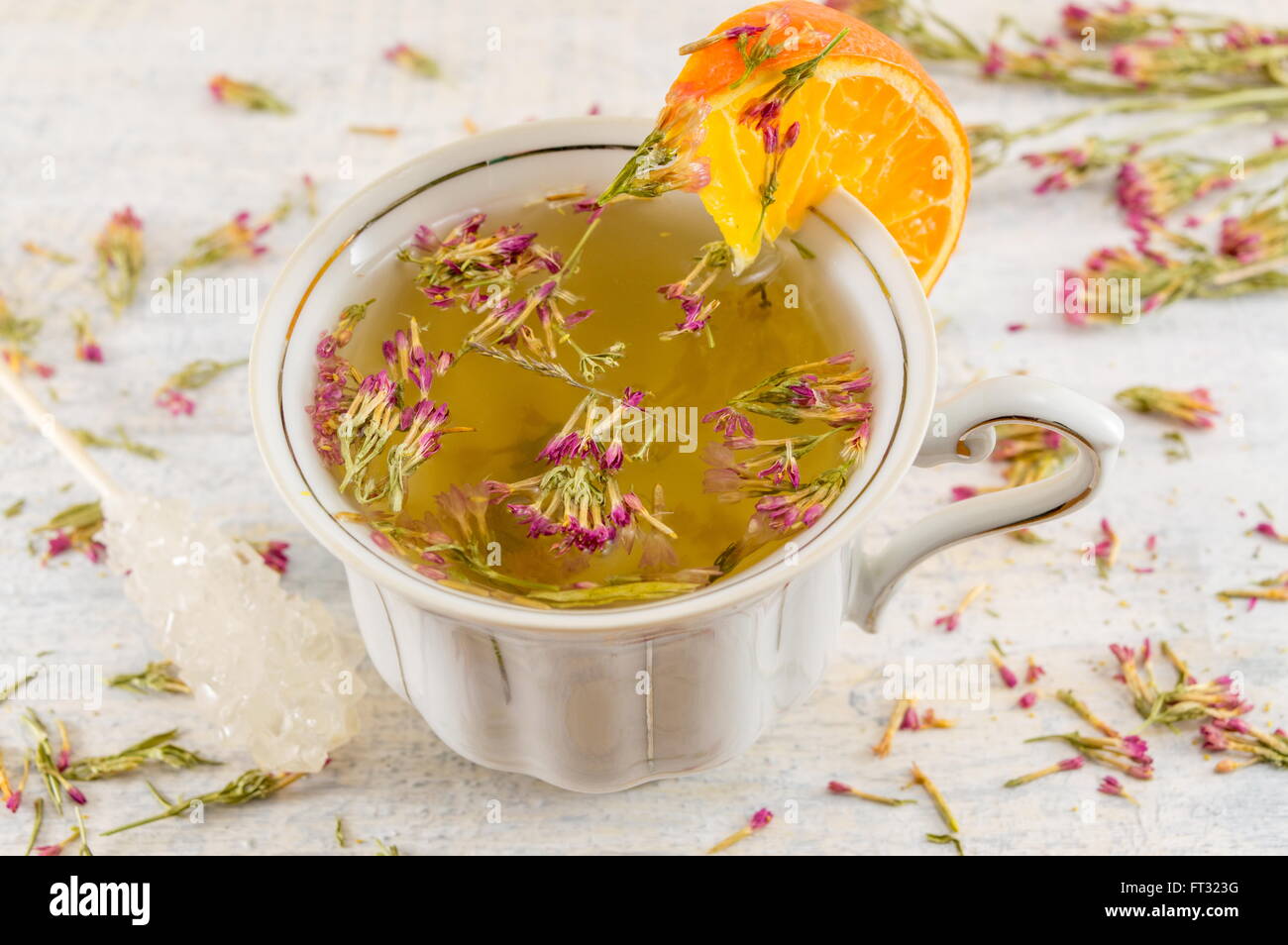 Hot bitter-grass tea in a teacup on a decorated table Stock Photo