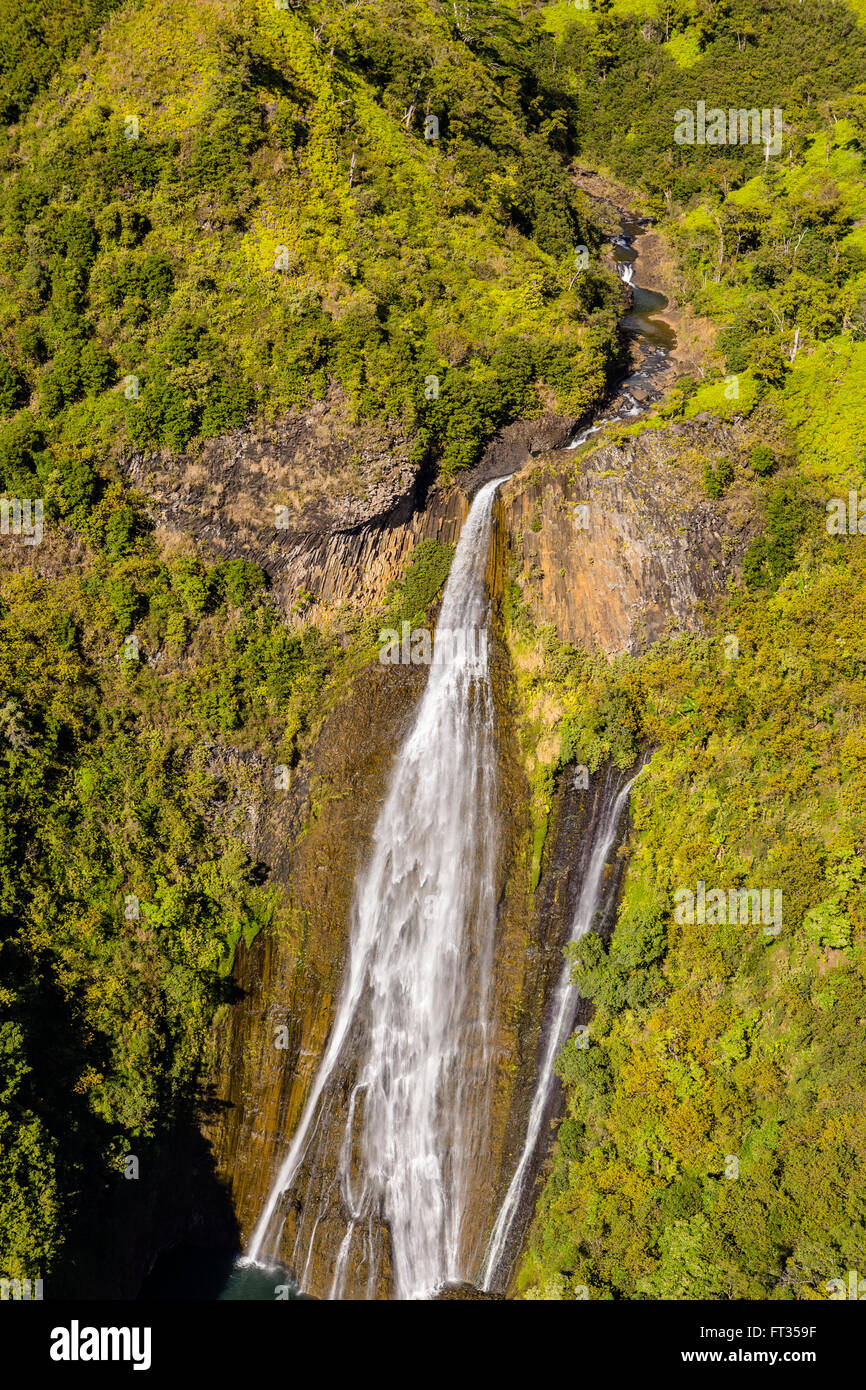 Aerial view of waterfall in mountains of Kauai Stock Photo