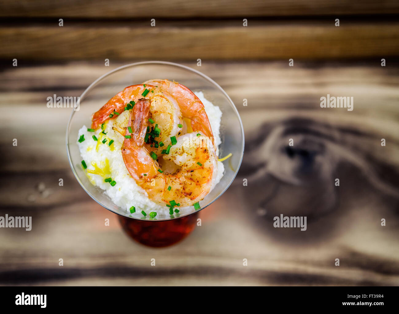 Small serving of shrimp and grits in a martini glass Stock Photo Alamy