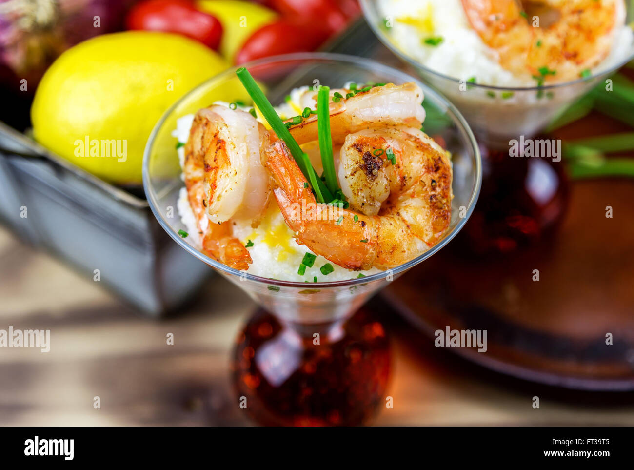 Small serving of shrimp and grits in a martini glass Stock Photo Alamy