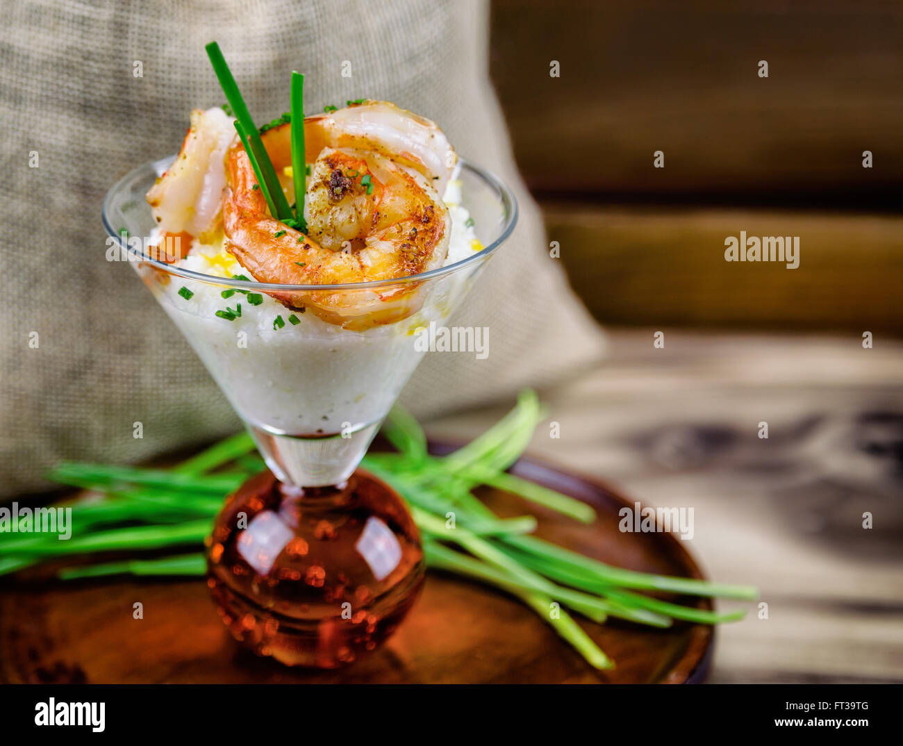 Small serving of shrimp and grits in a martini glass Stock Photo Alamy