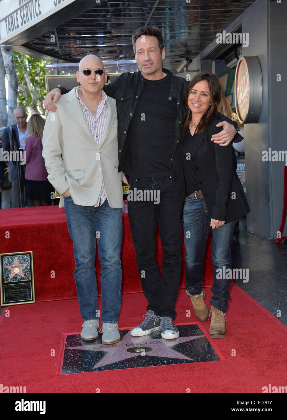 LOS ANGELES, CA - JANUARY 25, 2016: Actor David Duchovny & Californication co-stars Evan Handler & Pamela Adlon on Hollywood Boulevard where he was honored with the 2,572nd star on the Hollywood Walk of Fame. Stock Photo