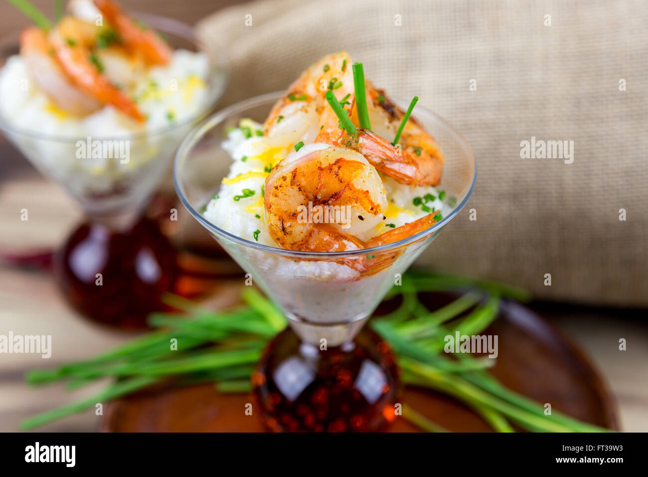 Small serving of shrimp and grits in a martini glass Stock Photo Alamy