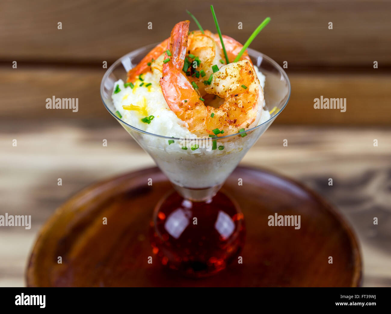 Small serving of shrimp and grits in a martini glass Stock Photo Alamy