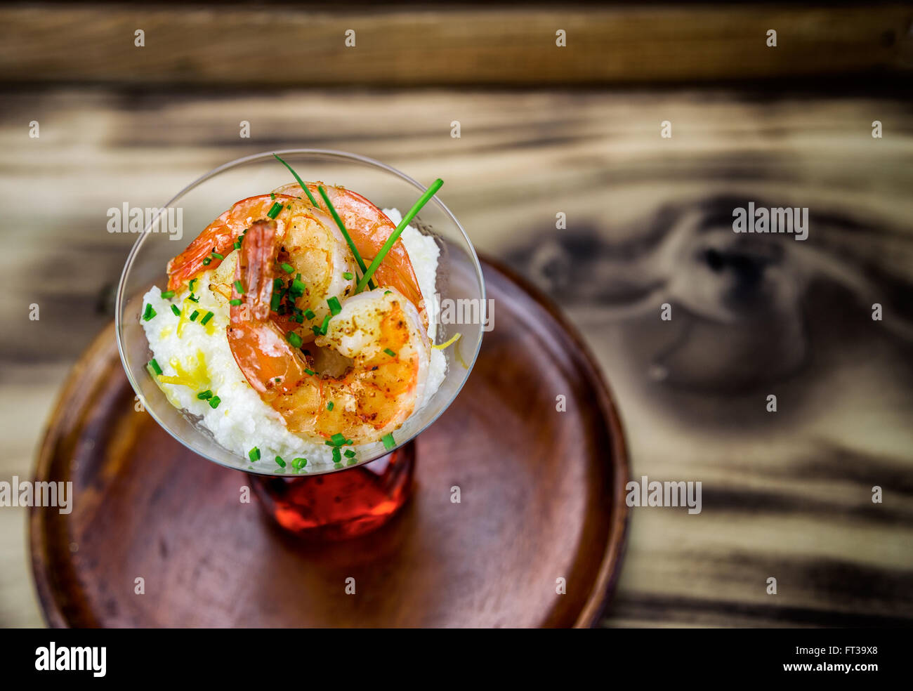 Small serving of shrimp and grits in a martini glass Stock Photo Alamy