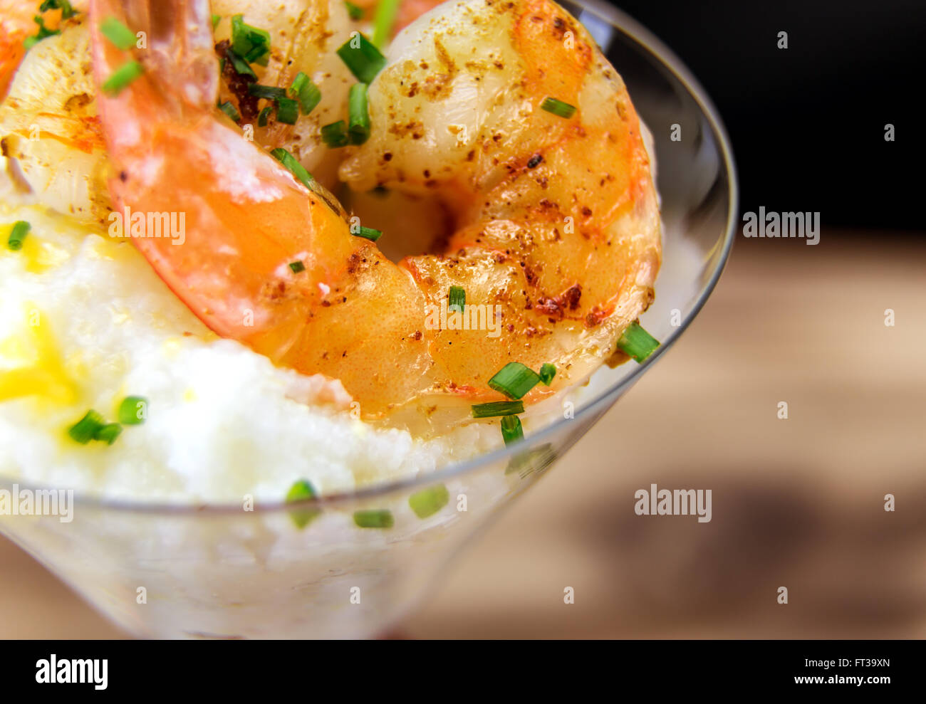 Small serving of shrimp and grits in a martini glass Stock Photo Alamy