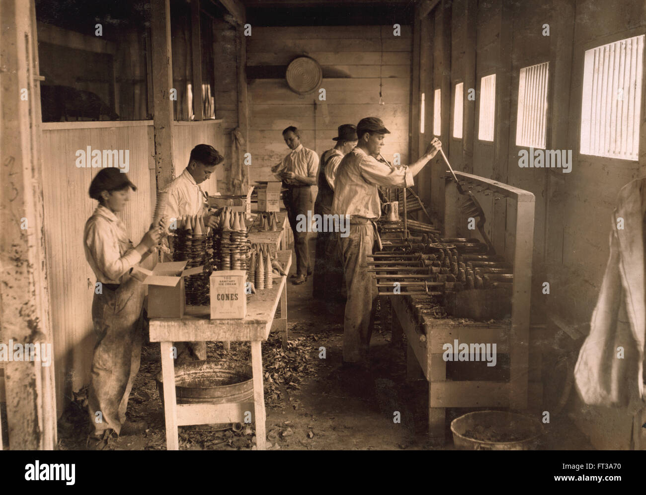 Two Young Boys Packing Cones at Ice Cream Cone Factory, Oklahoma City