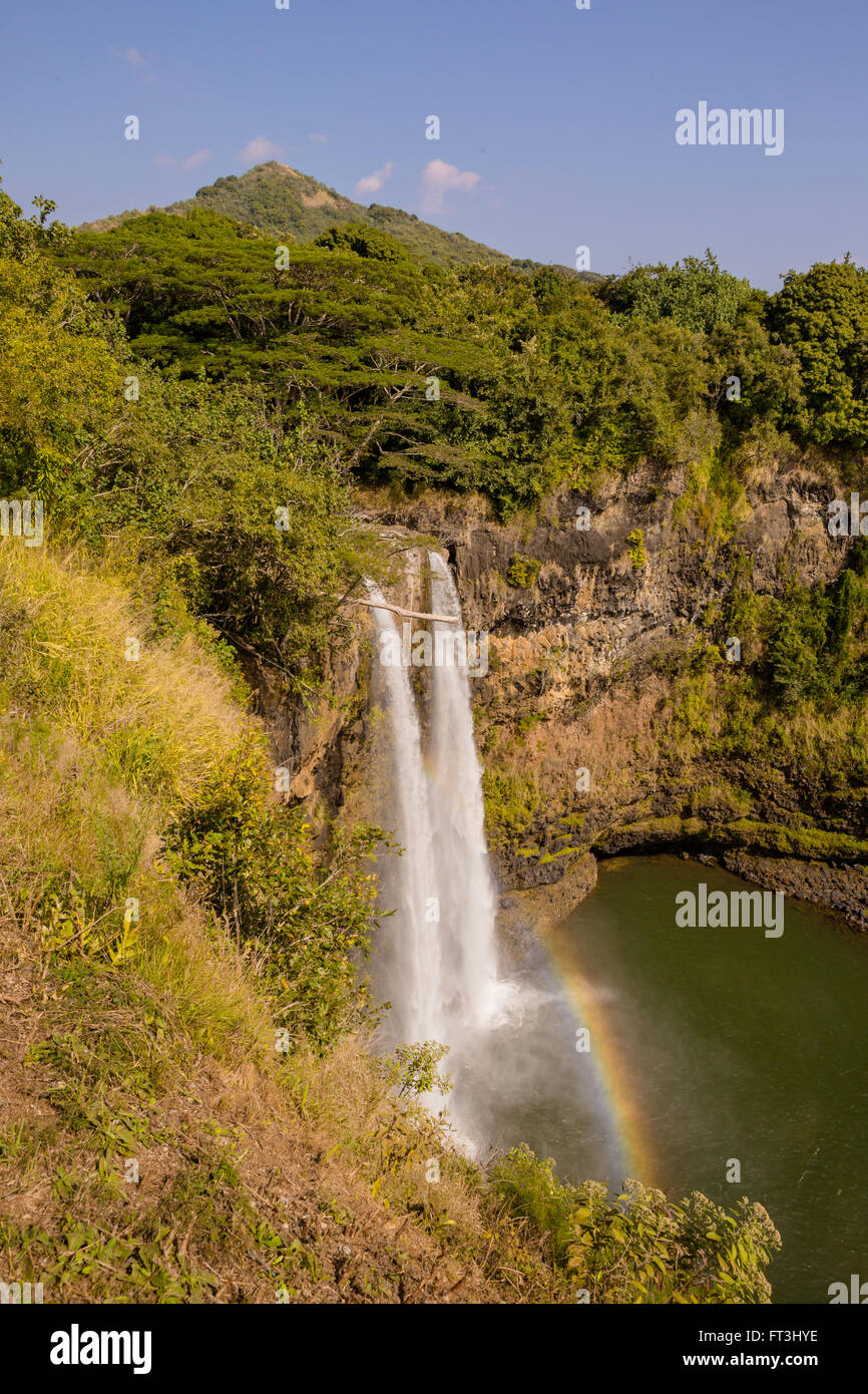 Rainbow at Twin Waterfalls in Kauai Hawaii.jpg Stock Photo