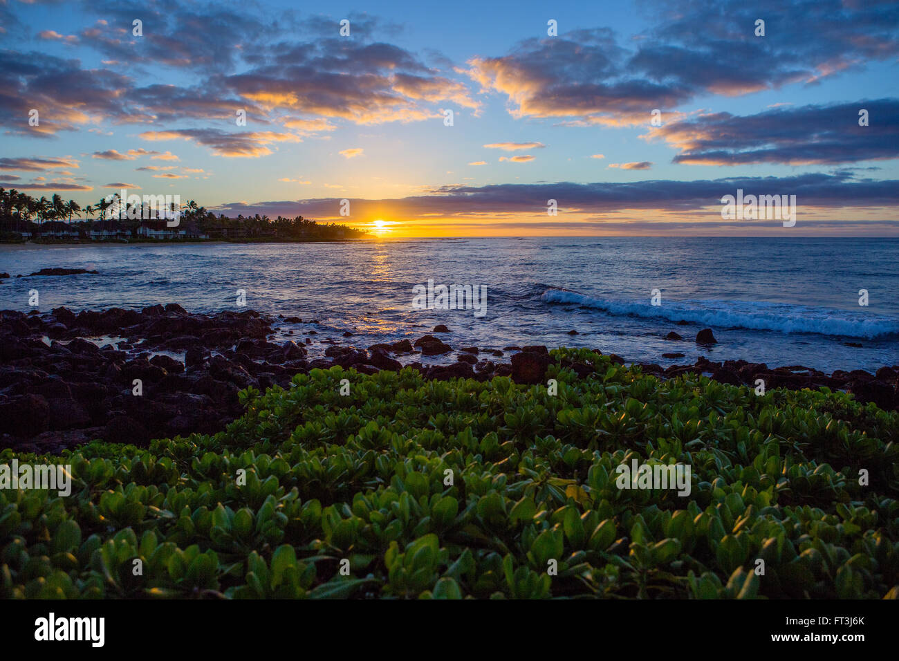 Sunrise over Poipu Beach Stock Photo - Alamy