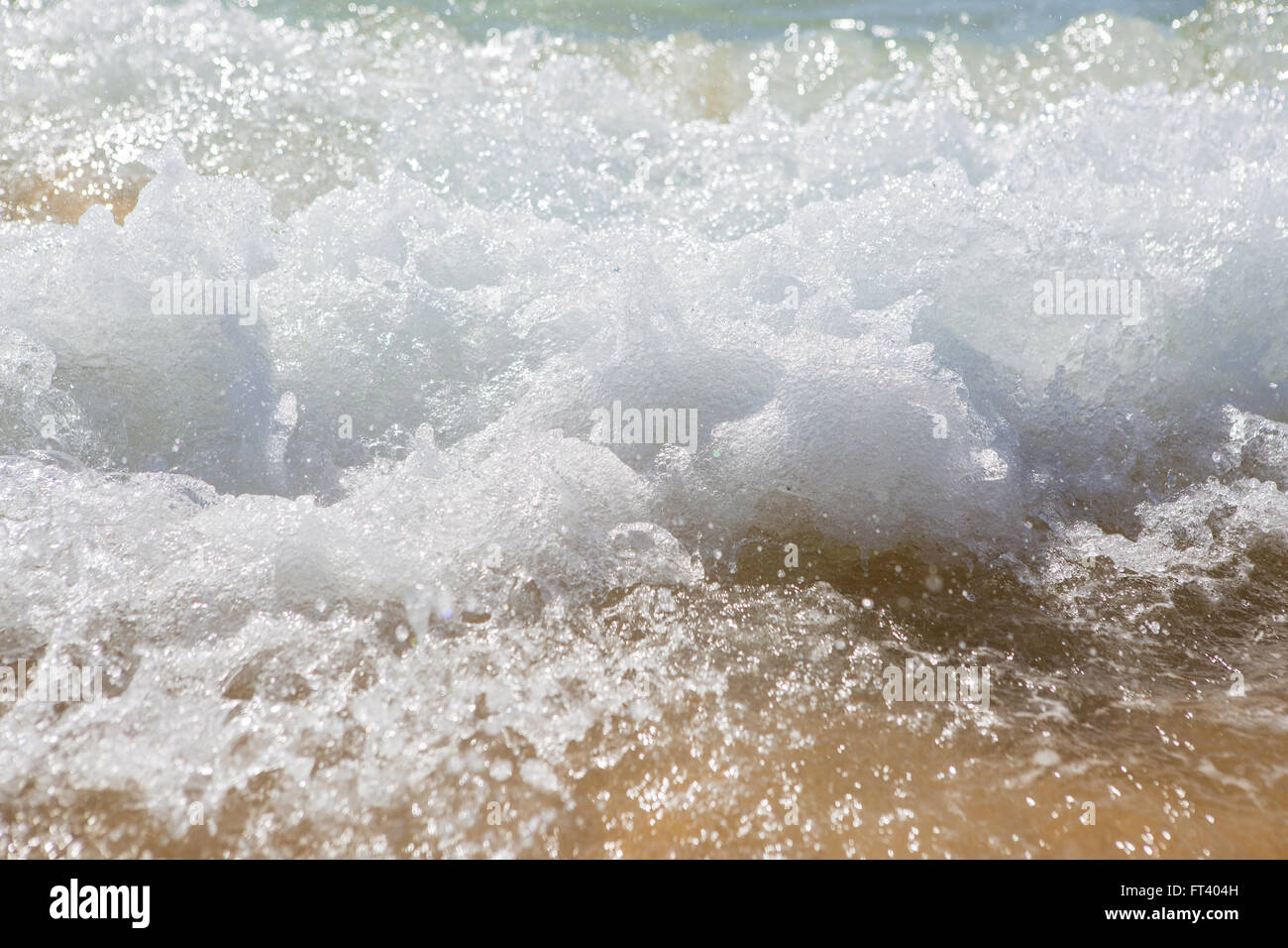 Wave splashes on sunny day Stock Photo