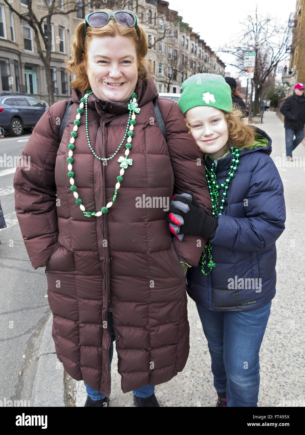 Irish-American mother and daughter at St.Patrick's Day Parade in the Park Slope neighborhood of Brooklyn, New York, 2016. Stock Photo