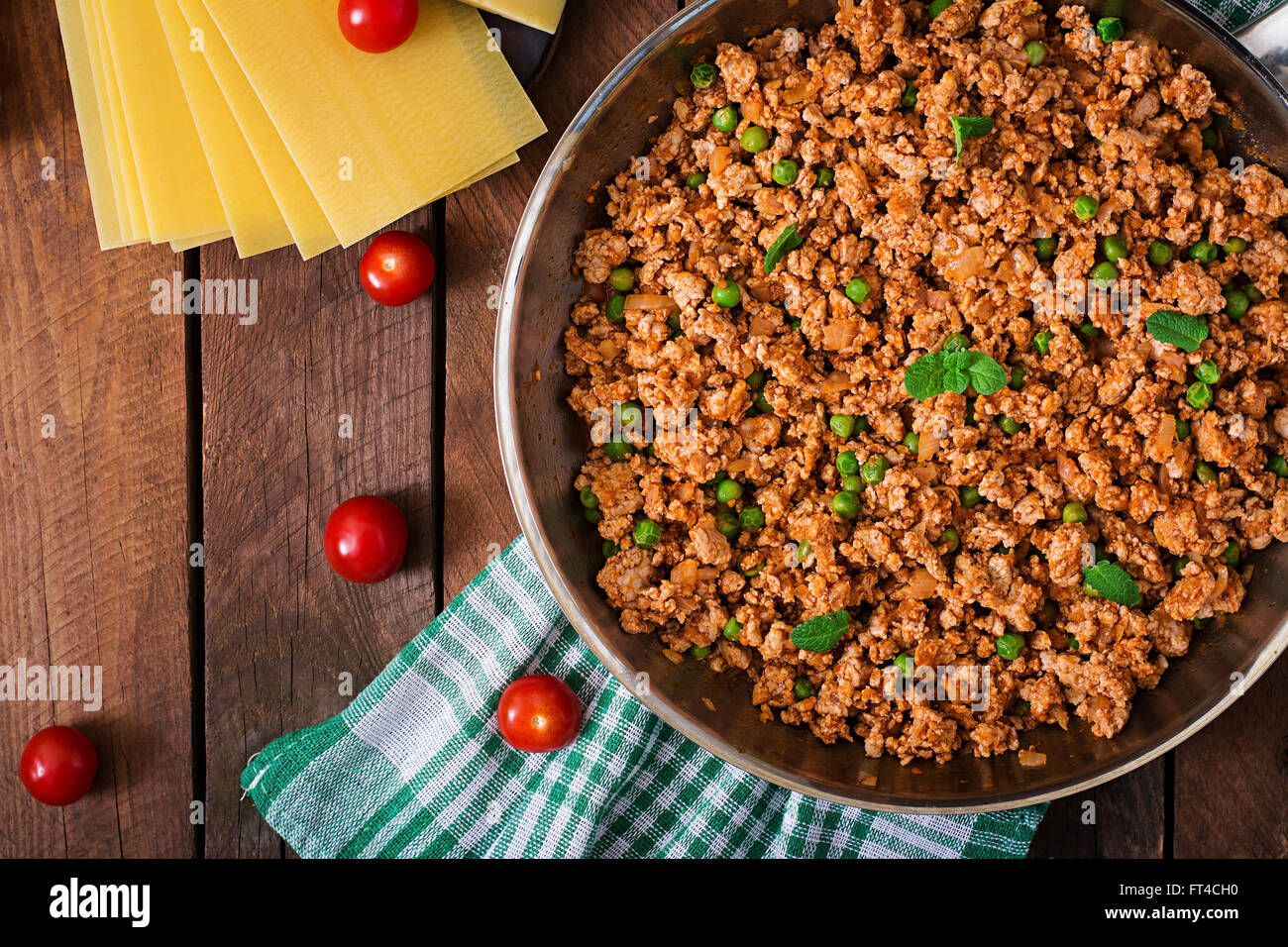 Minced meat in a frying pan for stuffing lasagna. Top view Stock Photo