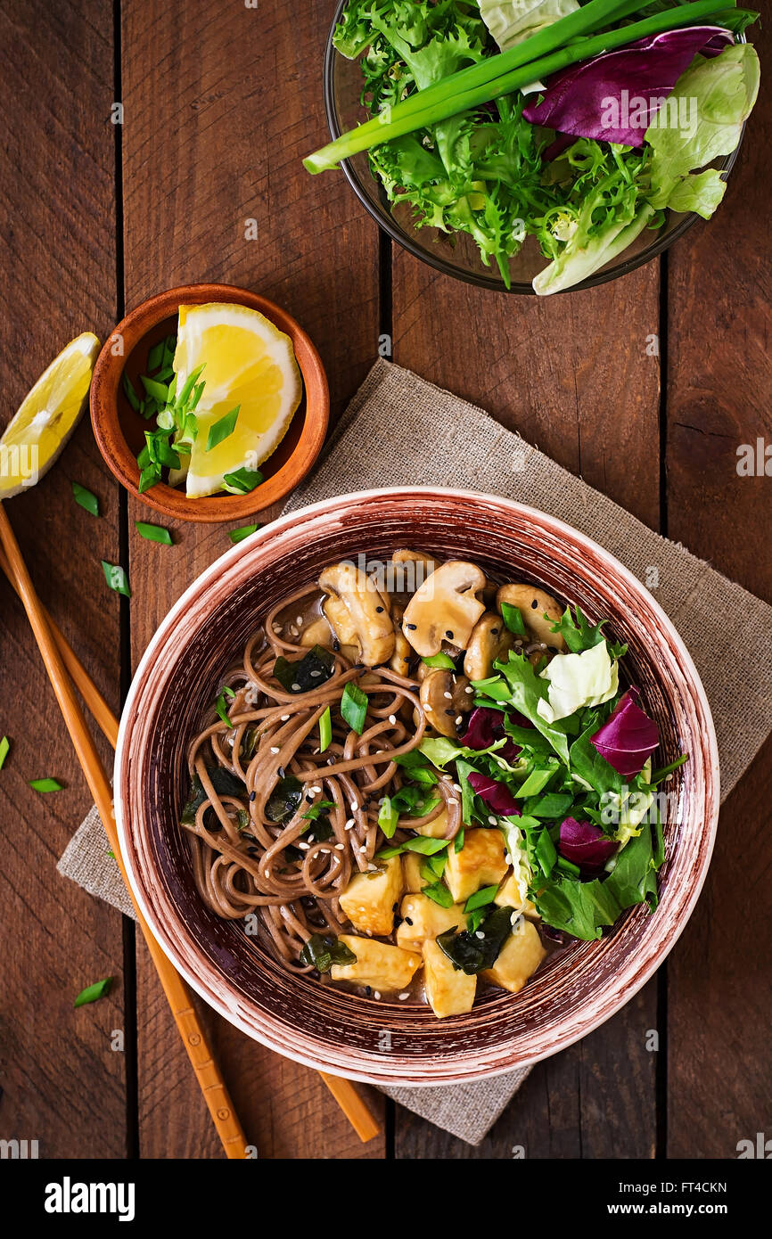 Miso and soba noodle soup with roasted tofu and mushrooms. Top view Stock Photo Alamy