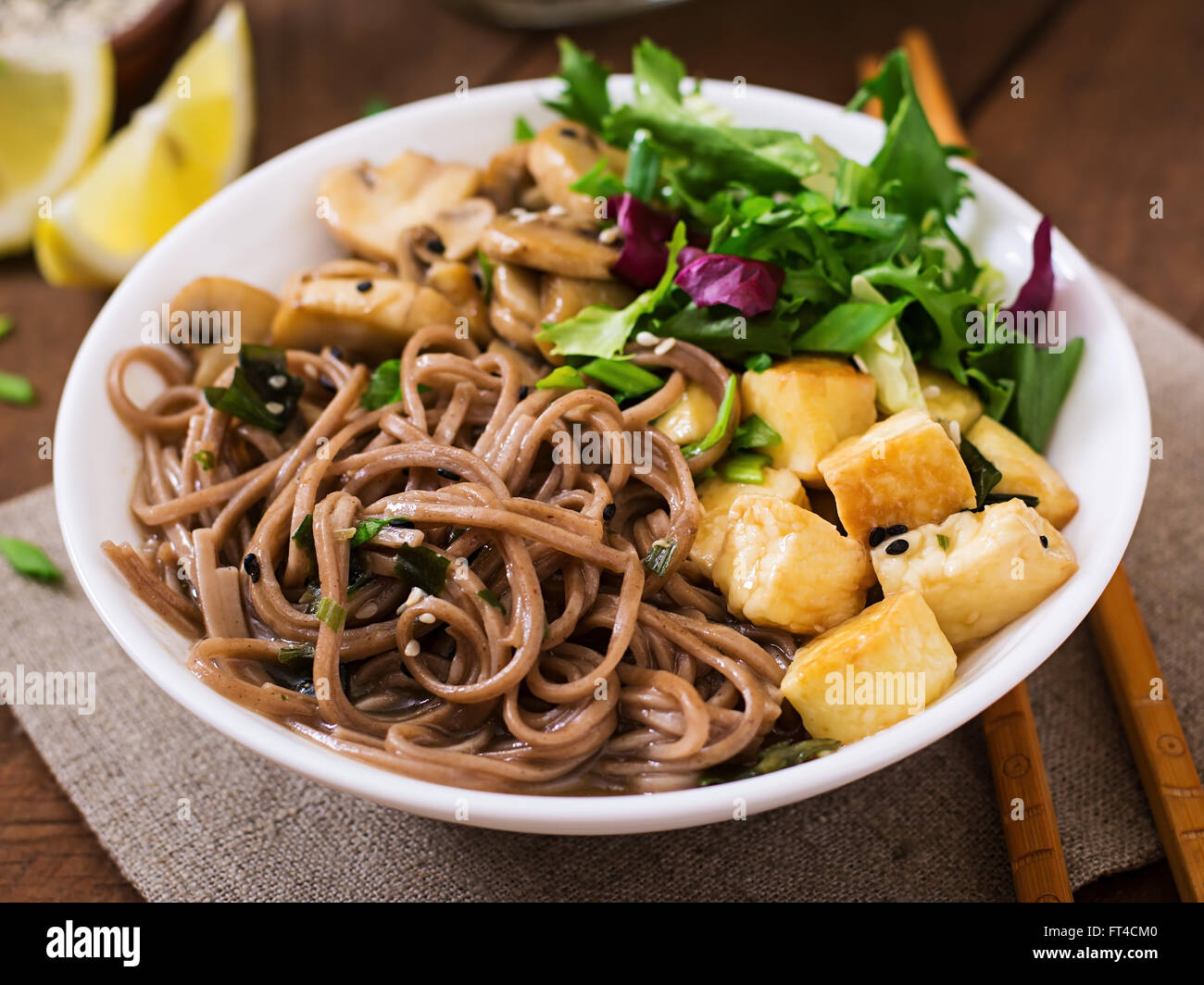 Miso and soba noodle soup with roasted tofu and mushrooms Stock Photo Alamy