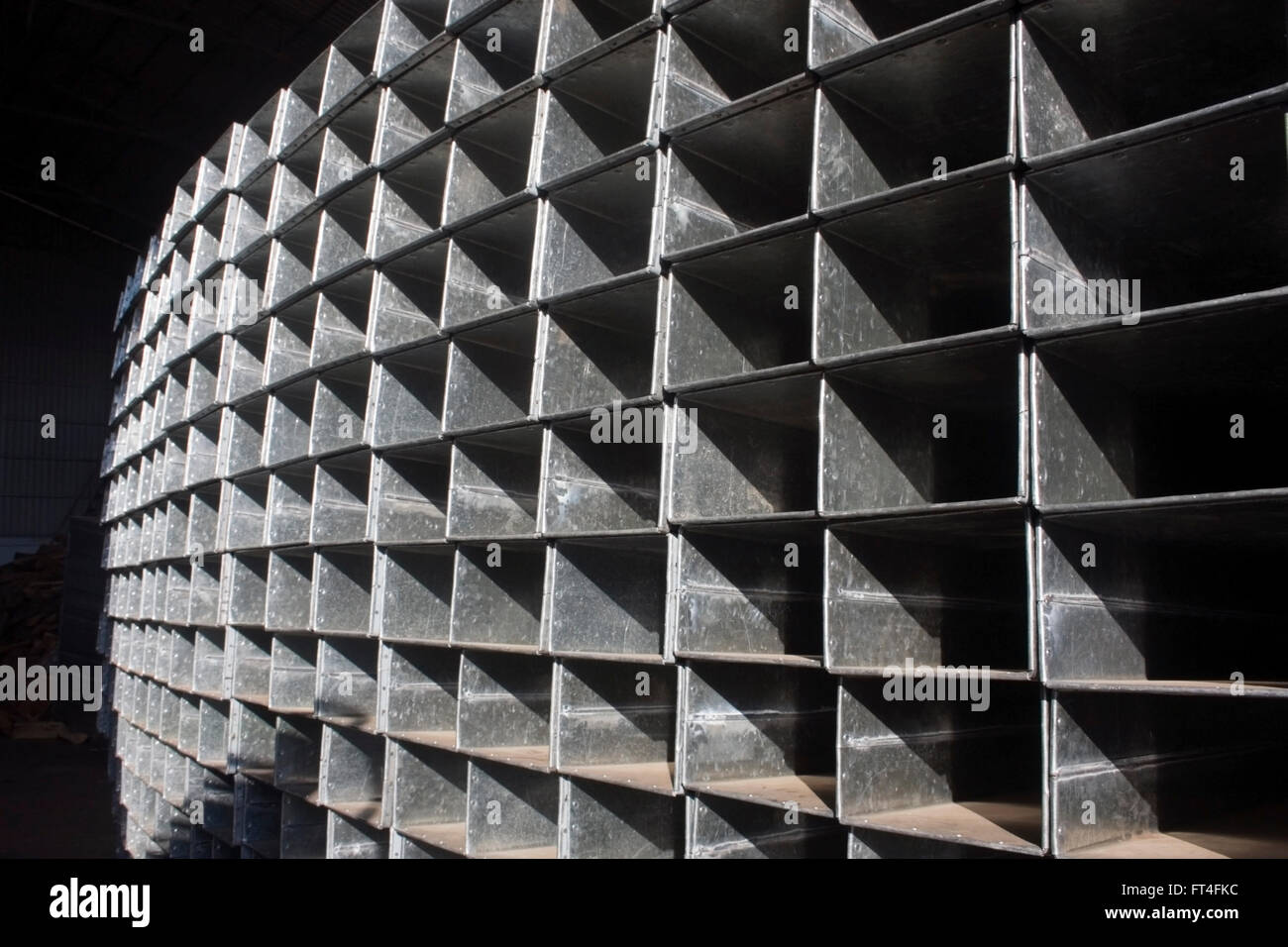 https://c8.alamy.com/comp/FT4FKC/manufactured-sheet-metal-cubes-are-stacked-at-the-im-chheng-factory-FT4FKC.jpg