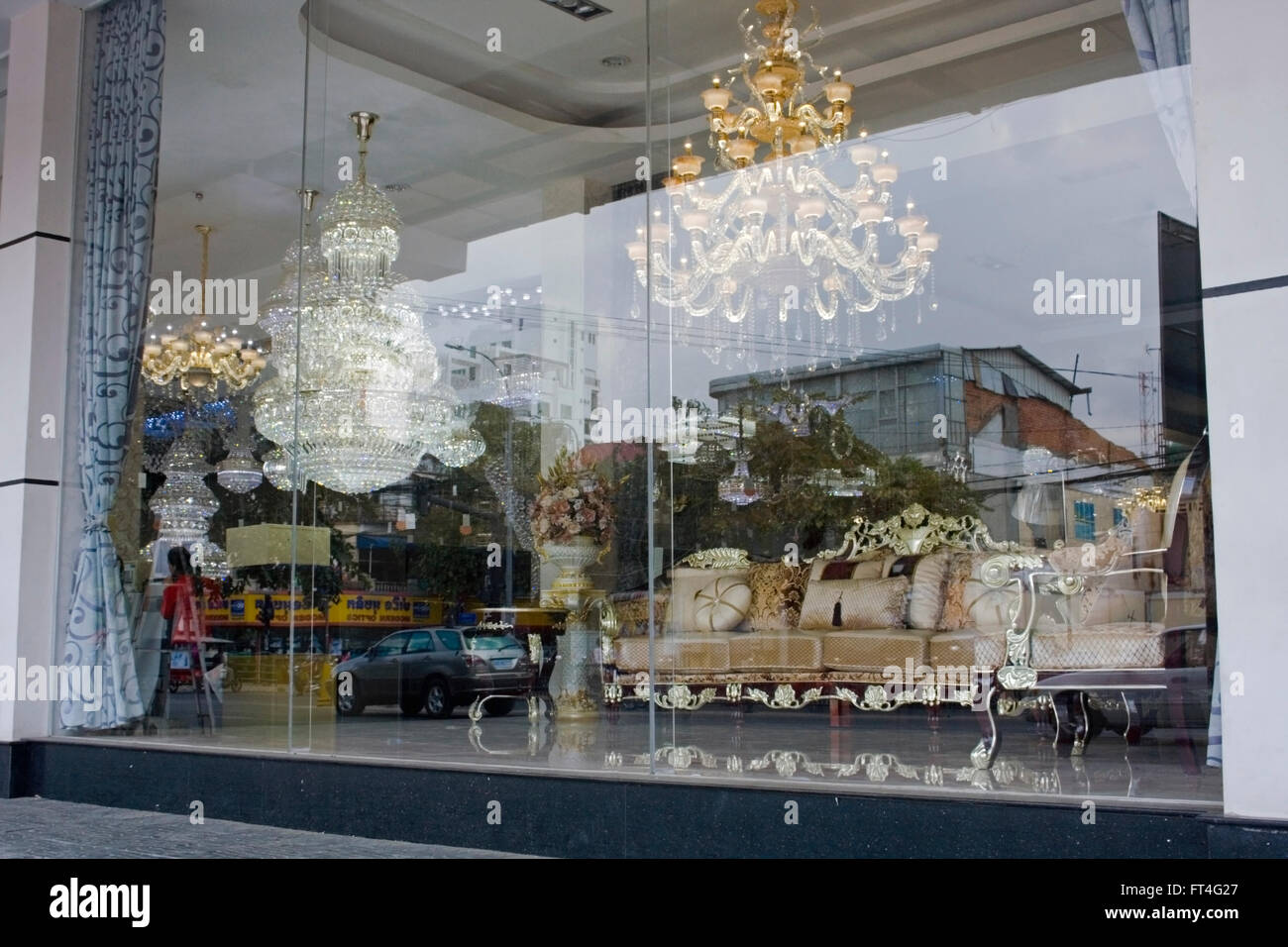 An expensive retail furniture store displays chandeliers in a store