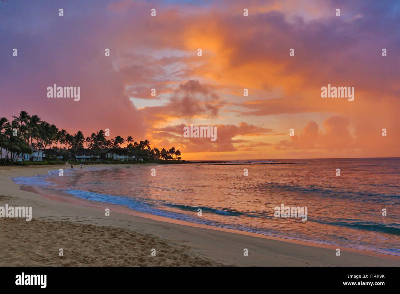 Orange sunrise over Poipu Beach Stock Photo - Alamy