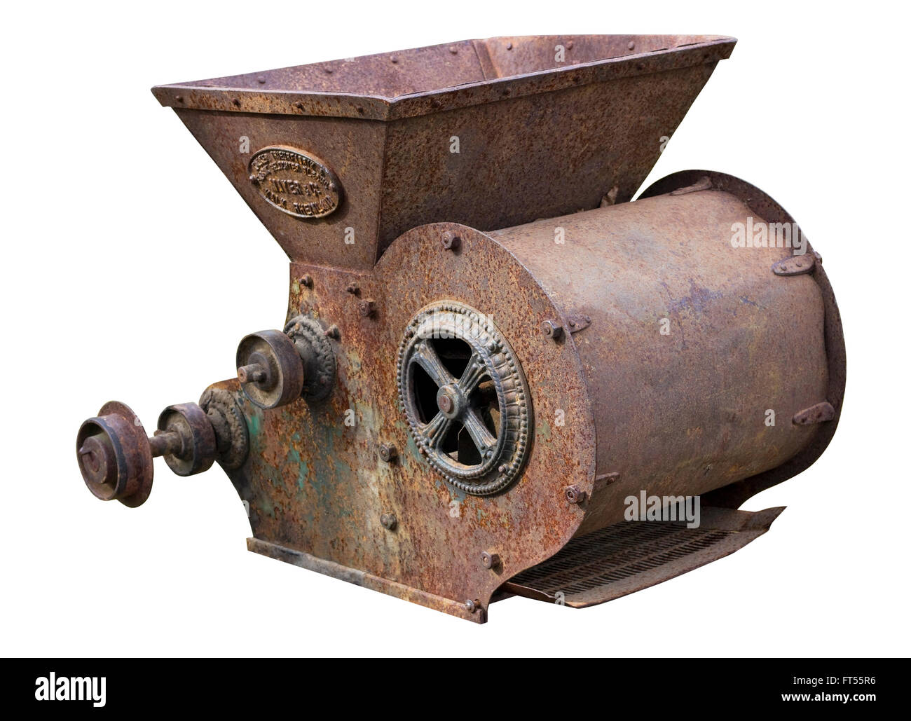 Retro   agricultural machinery - mechanism for  crushing of straw. Equipment is made more than hundred years ago.  Isolated on w Stock Photo