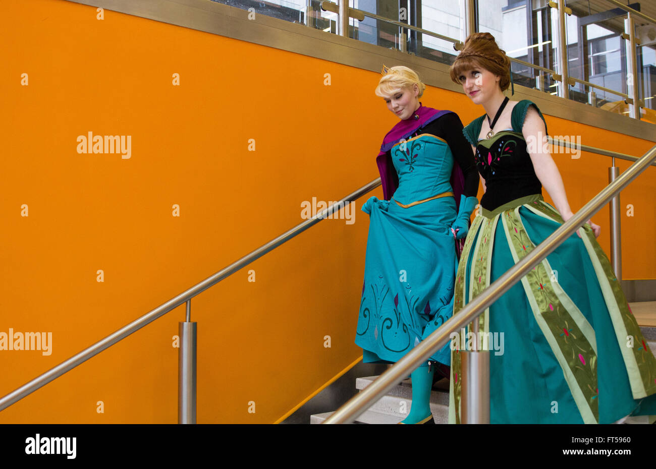 Elsa and Ana from 'Frozen' walking down stairs Stock Photo