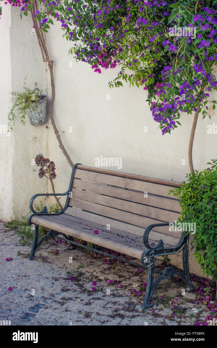 Decorative bench before a house wall Stock Photo