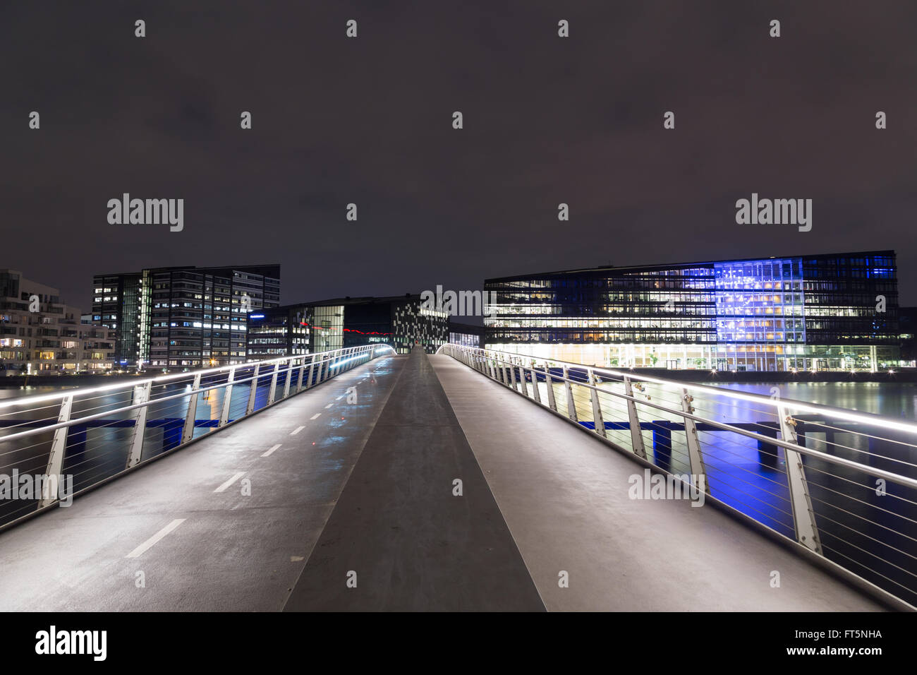 Copenhagen, Denmark - March 22, 2016: Modern cyclist and pedestrian bridge Bryggebroen by night Stock Photo