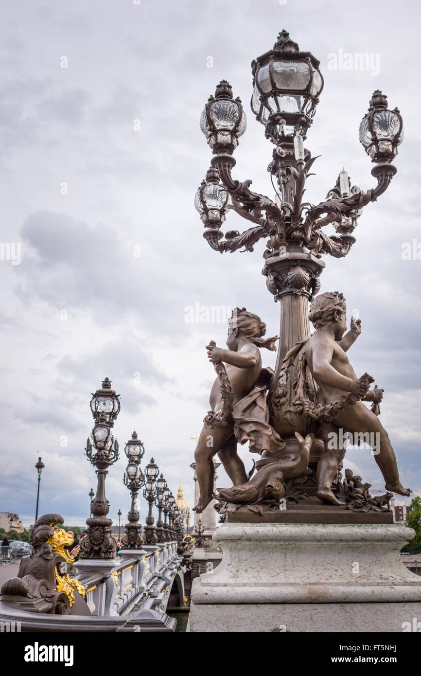Pont Alexandre III bridge in Paris with cherubs statue and lanterns ...