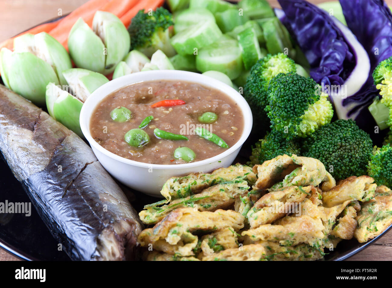 Fish Saba shoyu yaki and Shrimp paste chili sauce with blanched vegetables and Cha vegetables fried eggs Stock Photo