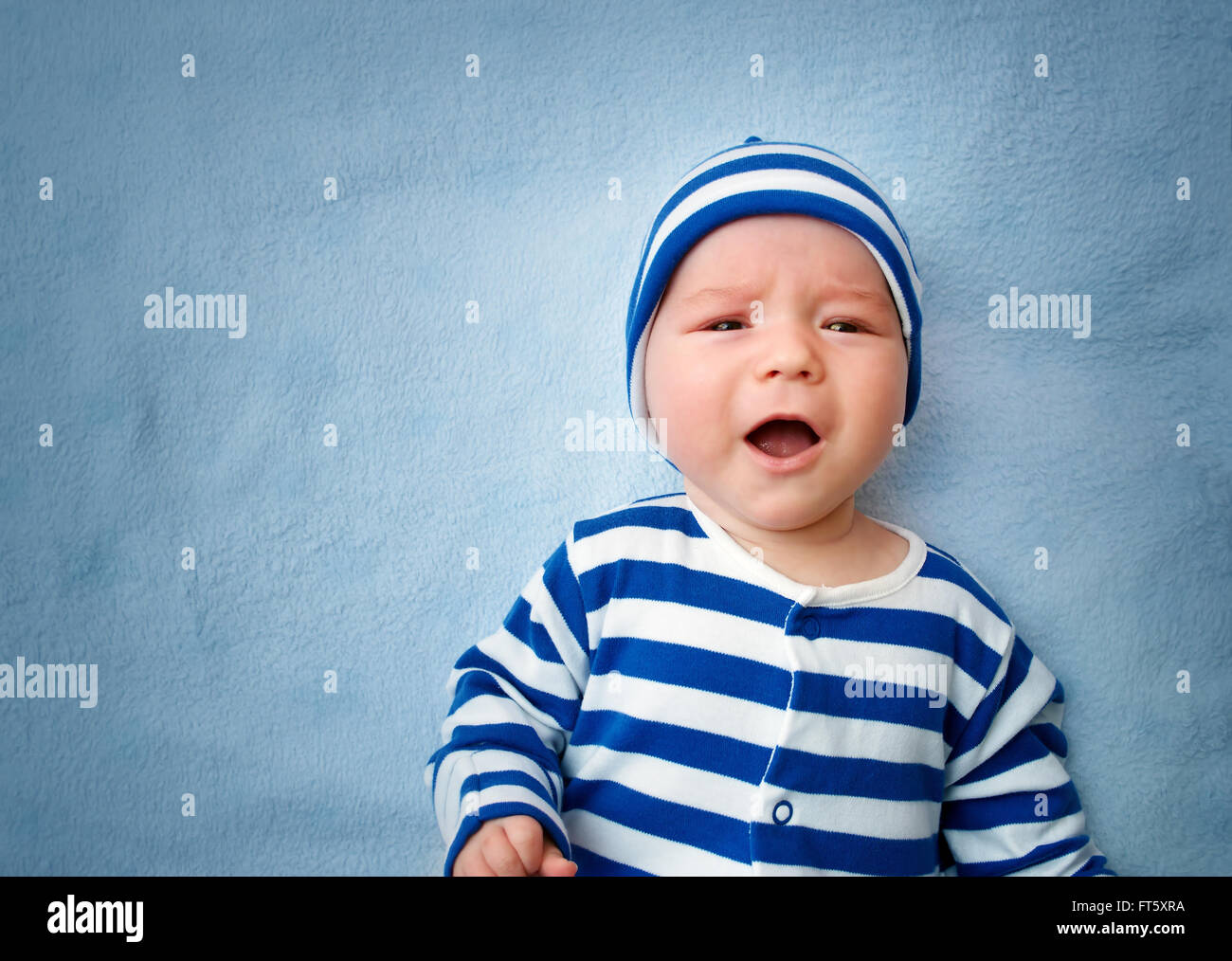 Baby crying in bed Stock Photo Alamy