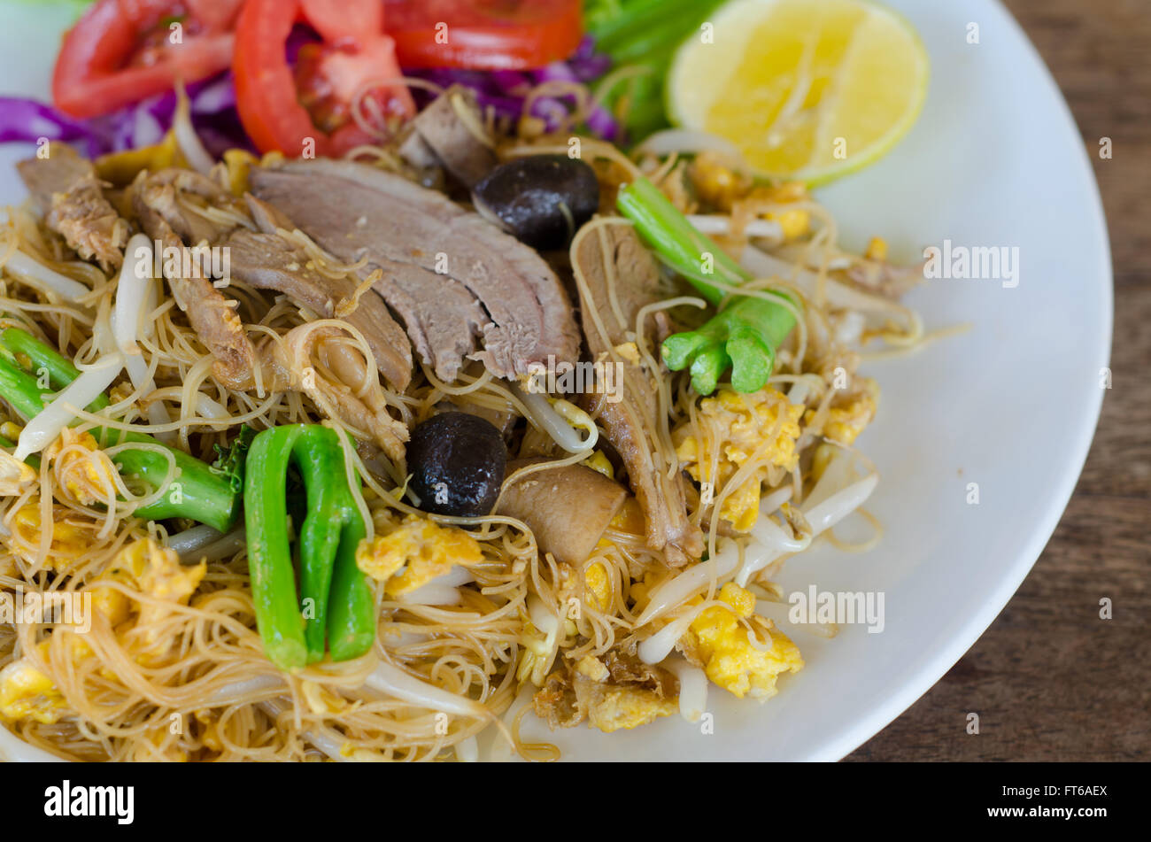 Thai style stir fried rice noodle with duck and vegetable Stock Photo