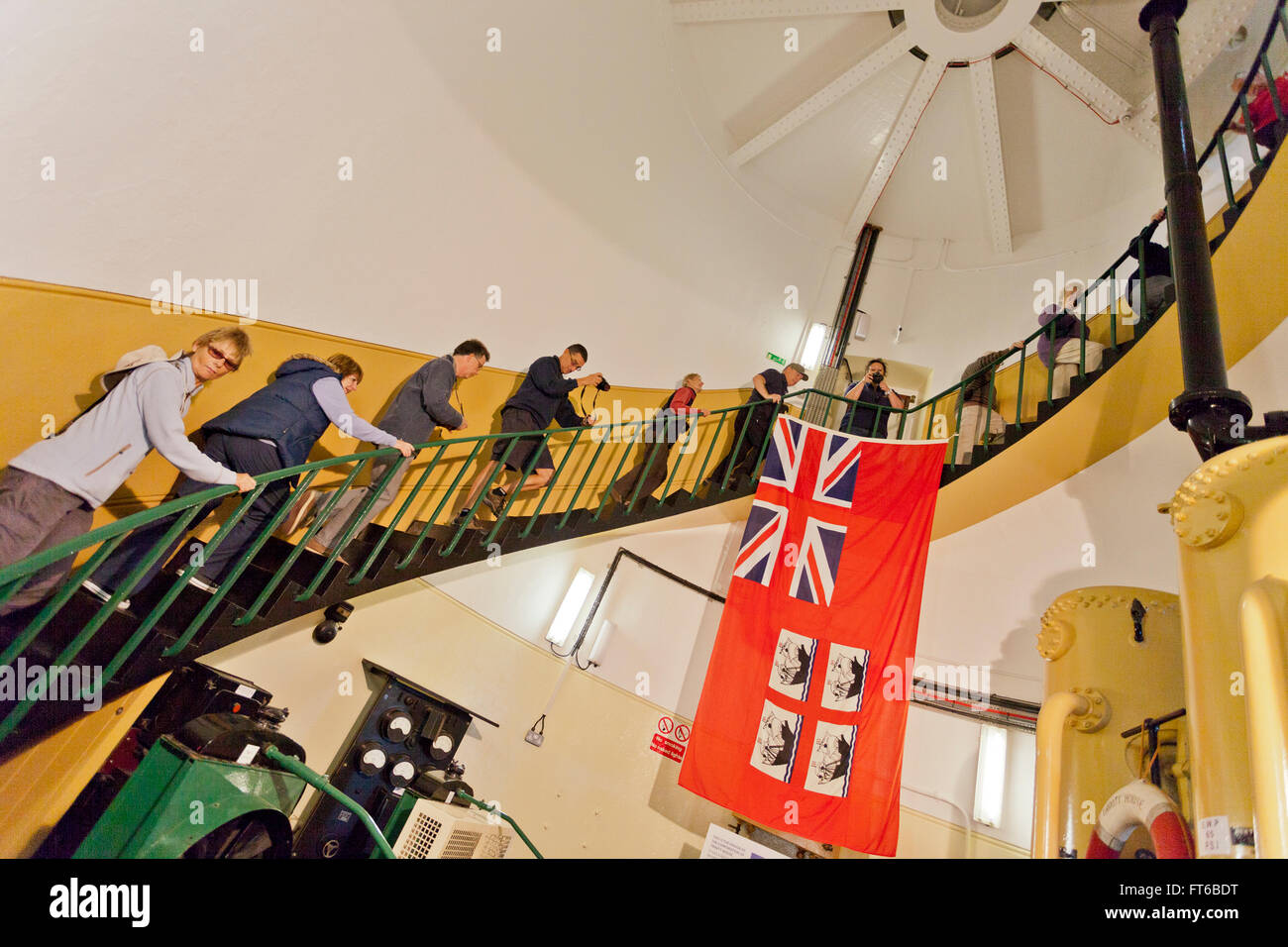Visitors climbing the stairs to the lantern at Portland Bill lighthouse on the Jurassic Coast in Dorset, England, UK Stock Photo