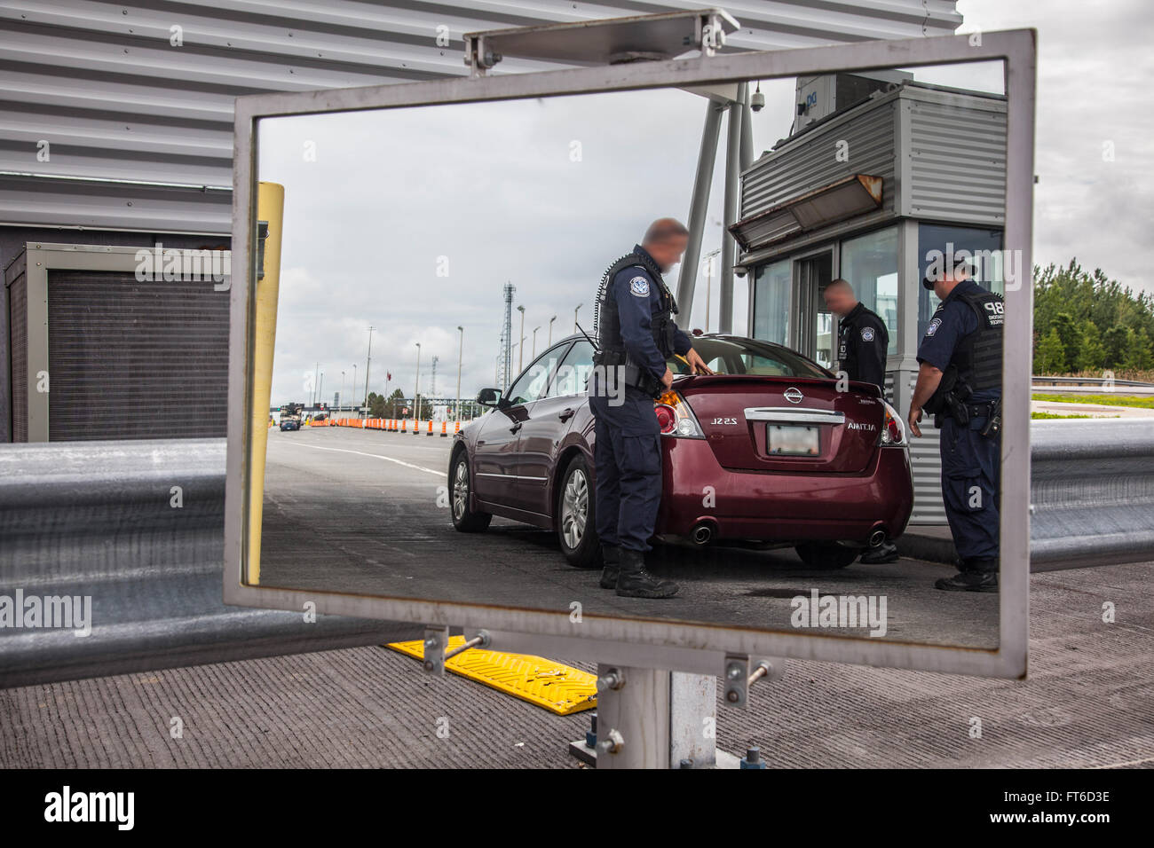 CBP officers search the truck of a vehicle leaving the United States on June 15 as part of the search effort of escaped convicts Richard Matt and David Sweat. Photo by: Krisoffer Grogan Stock Photo