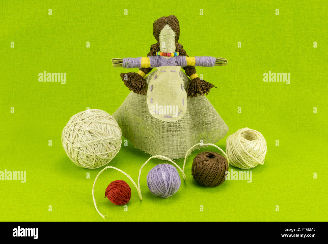 A folk handmade doll made of straw, linen and balls of wool Stock Photo