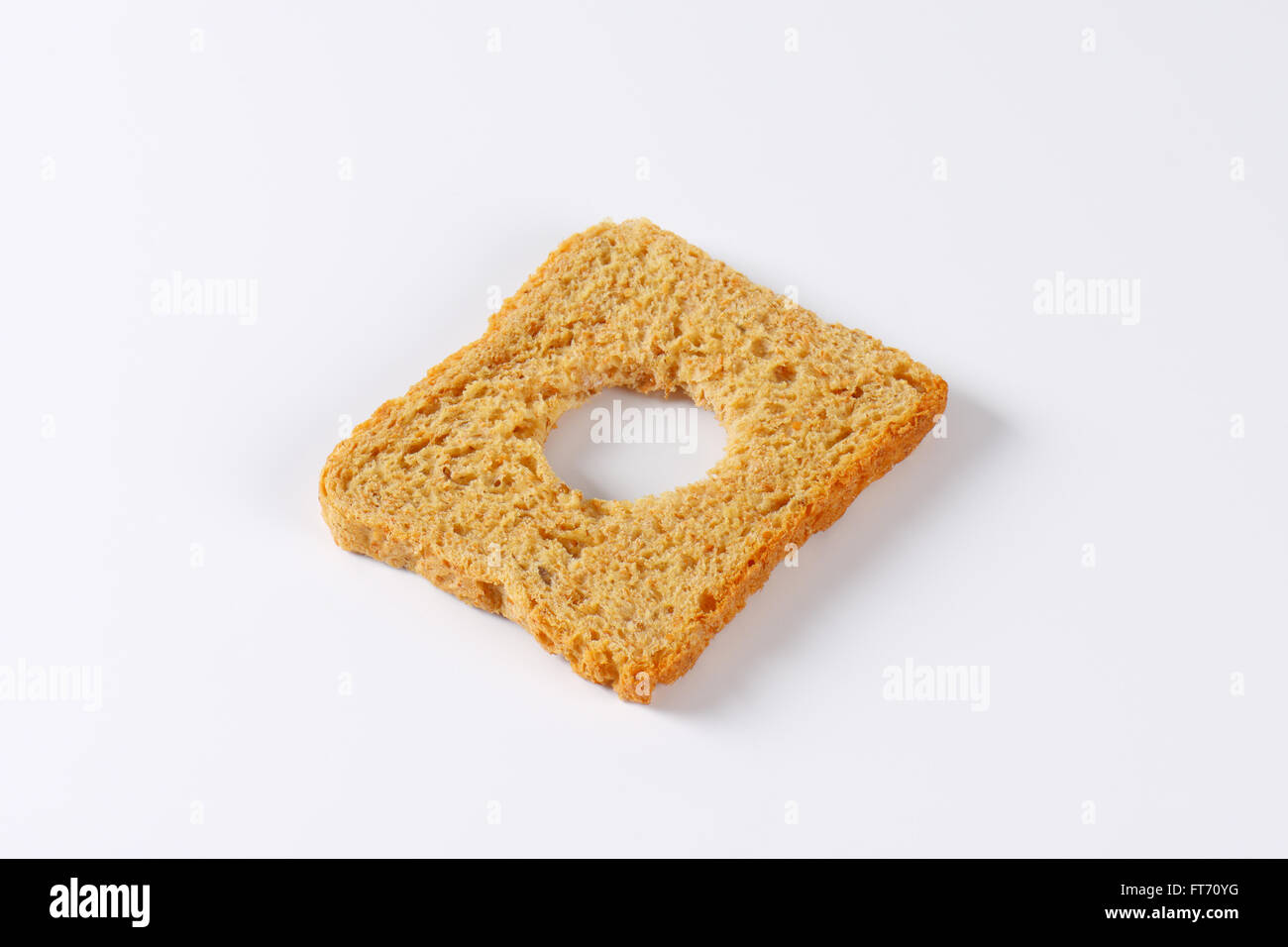 Slice of bread with cut out circle shape Stock Photo Alamy