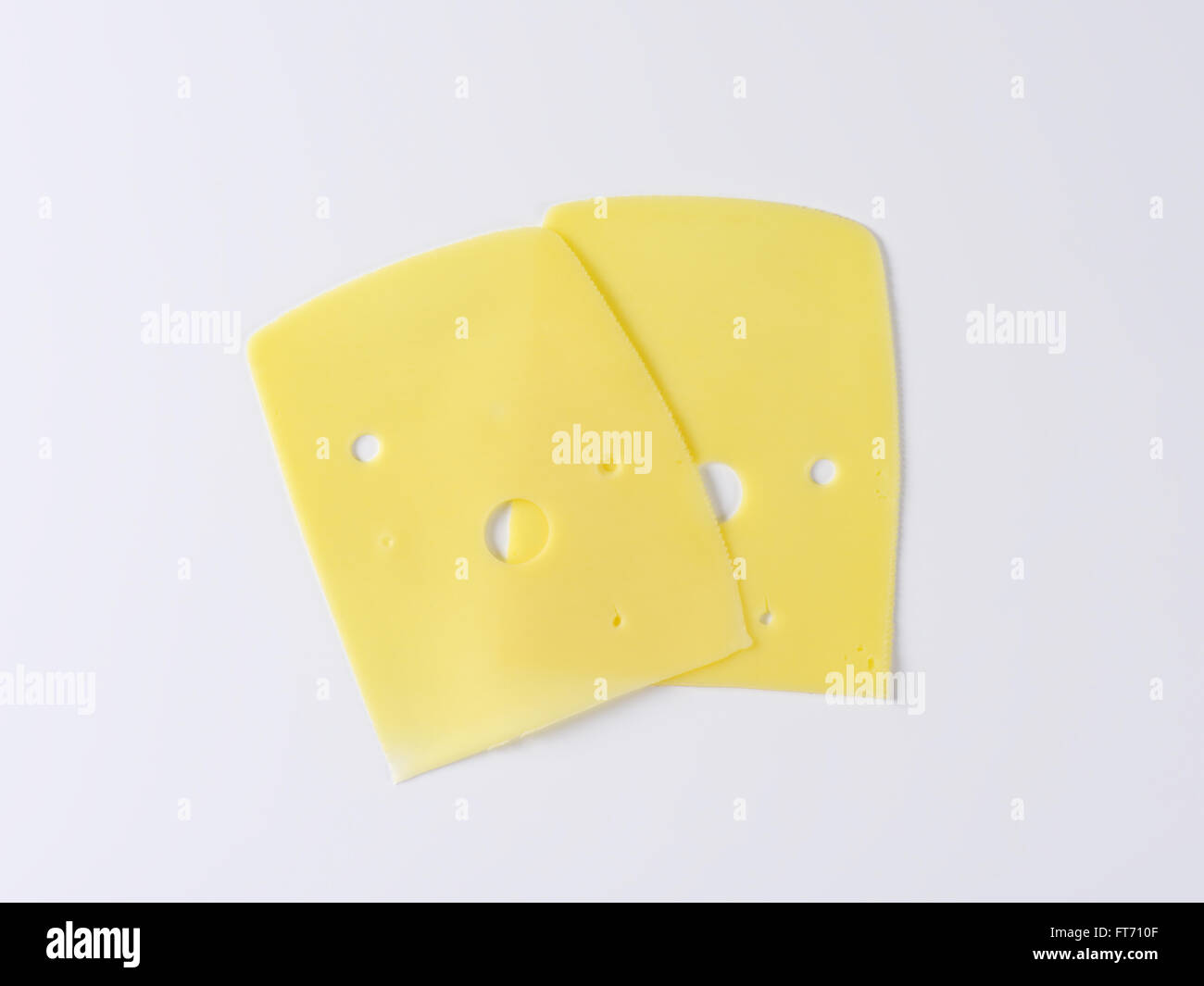 two slices of medium-hard emmental cheese Stock Photo